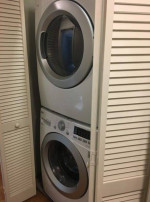 In-unit washer and dryer in a cozy apartment laundry area at Stone Farm Apartments, Lebanon, NH.