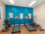 Fitness center with treadmills and elliptical machines in Miramar apartment, Kissimmee, FL