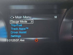 Main menu display of a 2015 Mustang GT showing gauge mode and trip details with low mileage.
