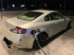 06 Infiniti G35 Coupe at gas station, featuring black rims and new headlights, showing some exterior wear.