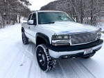 Chevrolet Silverado trucks in the snow, showcasing performance upgrades and a rust-free exterior.