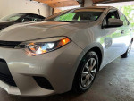 2016 Toyota Corolla in excellent condition with low mileage and new tires for sale in garage.