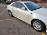 2013 Cadillac CTS 4 AWD luxury collection in pearl white parked, showcasing its elegant design and new tires.