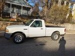 2011 Ford Ranger pickup truck for sale, in good condition with minor mechanical issues, located on a residential street.