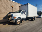 2007 Ford F-650 XLT truck with 112K miles and 5.9 Cummins engine parked on the street.