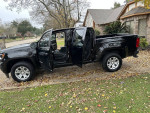 2021 Chevrolet Colorado LT 4WD in excellent condition with open doors, showcasing interior and exterior design.