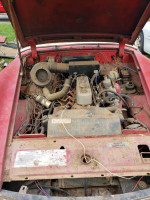 1962 MG Midget convertible engine bay, not running, selling for parts or restoration project.