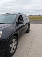 Side view of a 2012 GMC Acadia SLT AWD, featuring a rust-free body and new re-manufactured motor.