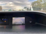 Honda Civic reverse camera display showing guidelines for safe parking and surroundings.