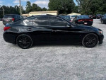 Black Infiniti Q50 sedan parked among other vehicles, showcasing its sleek design and style.