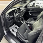 Interior of a 2014 Honda Accord EX with leather seats and modern dashboard features.