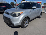 2015 Kia Soul wagon in bright silver color with 64,127 miles, featuring alloy wheels and a modern design.