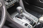 Interior view of 2018 Honda Civic EX FWD gear shift and controls, featuring a sleek design and advanced technology.