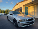 2002 BMW 5 Series 525i Wagon in silver with alloy wheels, shown parked outside, featuring sunroof and rear-wheel drive.