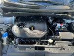 Engine compartment of a 2014 Kia Soul with a 2L I4 engine and 164 hp.