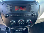 Interior control panel of a 2014 Kia Soul with Bluetooth and audio settings