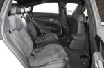 Interior view of the 2022 Audi e-tron GT Premium Plus showcasing spacious rear seating and refined design.