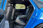 2024 Honda Civic Sport hatchback interior view showcasing rear seats and modern design.
