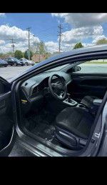 Interior view of a 2019 Hyundai Elantra Limited, featuring black seats and modern dashboard design.