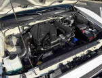 Engine compartment of a 2020 Toyota Tacoma SR showcasing versatile mid-size pickup truck features.