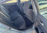 Interior view of a 2012 Honda Accord LX showing spacious back seating and grey upholstery.