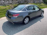 2008 Honda Accord EX-L in gray parked on the road, showcasing its sleek design and features.