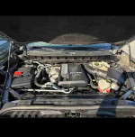 Engine compartment of a 2019 Chevrolet Silverado 1500 Duramax Diesel showcasing powerful specs and maintenance.