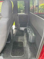 Interior view of a 2003 Chevrolet S-10 LS ZR2 extended cab showcasing clean upholstery and spacious design