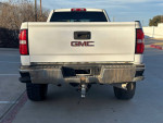 Rear view of a 2018 GMC Sierra 2500HD truck, showcasing its clean exterior and towing capabilities.