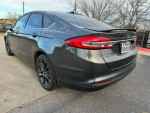 2018 Ford Fusion with low mileage parked, featuring heated seats and a sleek design.