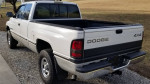 1996 Dodge Ram 1500 Laramie SLT 4x4 truck parked on gravel, showing clean exterior and new all-terrain tires.
