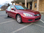2006 Honda Accord EXL, red sedan with gray leather interior and alloy wheels parked outside