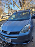 BraunAbility side entry van with a handicapped ramp, suitable for wheelchair access and equipped with cruise control.