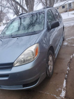 BraunAbility side entry van with handicapped ramp, minor cosmetic damage, running smoothly, includes wheelchair and accessories.