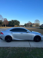2017 Lexus IS200t in excellent condition, silver color, parked on driveway under clear sky.