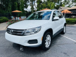 2015 Volkswagen Tiguan SE in white, parked with black leather interior and exterior features