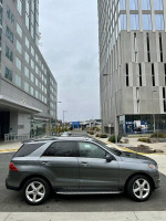 2018 Mercedes-Benz GLE 350 4MATIC in a city setting, showcasing its sleek design and modern features.
