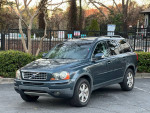 2007 Volvo XC90 3.2 AWD in blue, featuring a clean exterior, tinted windows and a sunroof, ideal family SUV.