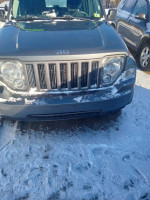 2012 Jeep Liberty Sport RWD in excellent condition, parked in snowy environment, featuring automatic transmission and power accessories.