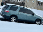 2009 GMC Acadia SUV in snow, clean title, needs engine repair, great family vehicle with lots of features.