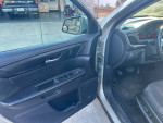 Interior view of a 2013 Chevrolet Traverse LT AWD, showcasing door features and dashboard.