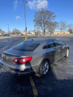 2010 Volkswagen CC in gray color parked, featuring clean lines and modern design, ideal for everyday commuting.