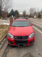 Red Volkswagen Jetta GLI for sale, 71,000 miles, great commuter car with snow tires