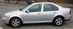 2004 Volkswagen Jetta TDI silver sedan parked, featuring alloy wheels and automatic transmission.