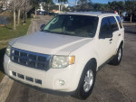 2009 Ford Escape XLT in white with Camel cloth interior, low mileage and excellent gas mileage.