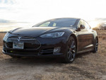 2014 Tesla Model S P85 showcased in a scenic outdoor setting, highlighting its sleek design and performance features.
