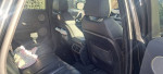 Interior view of a 2013 Land Rover Range Rover Evoque, featuring leather seats and large windows.