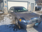 2001 Lincoln Town Car Signature in mint condition with leather interior and V8 engine, parked on a snowy driveway.