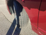 Close-up of a new Goodyear tire on a 2008 Honda Civic LX, showcasing its excellent condition.