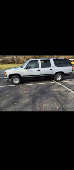 1994 GMC Suburban in a parking lot, showcasing its dependability and recent repairs.